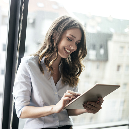 Woman looking at tablet